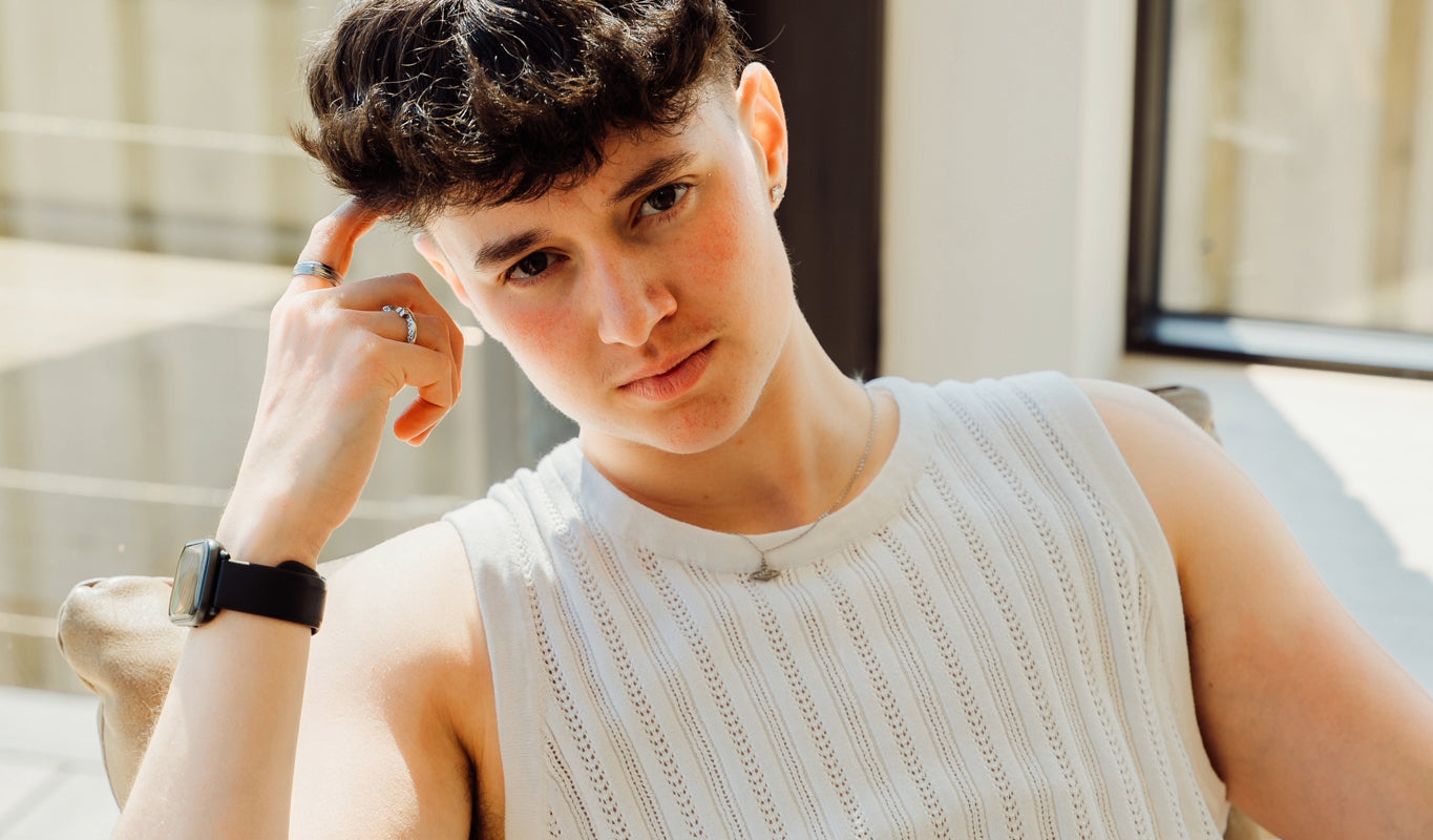 A person wearing a white vest