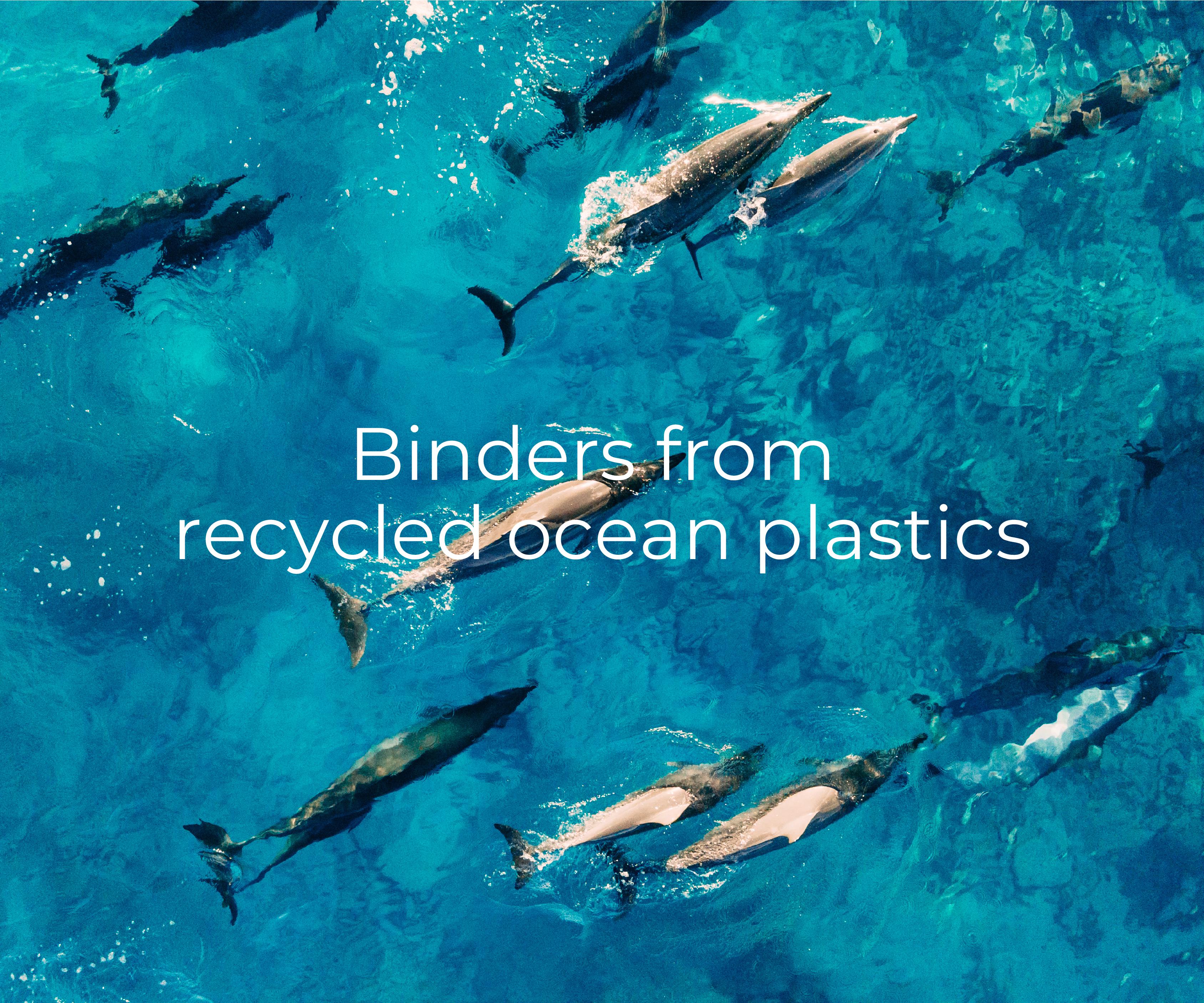 Dolphins swimming in background. Foreground text "Binders from recycled ocean plastics"