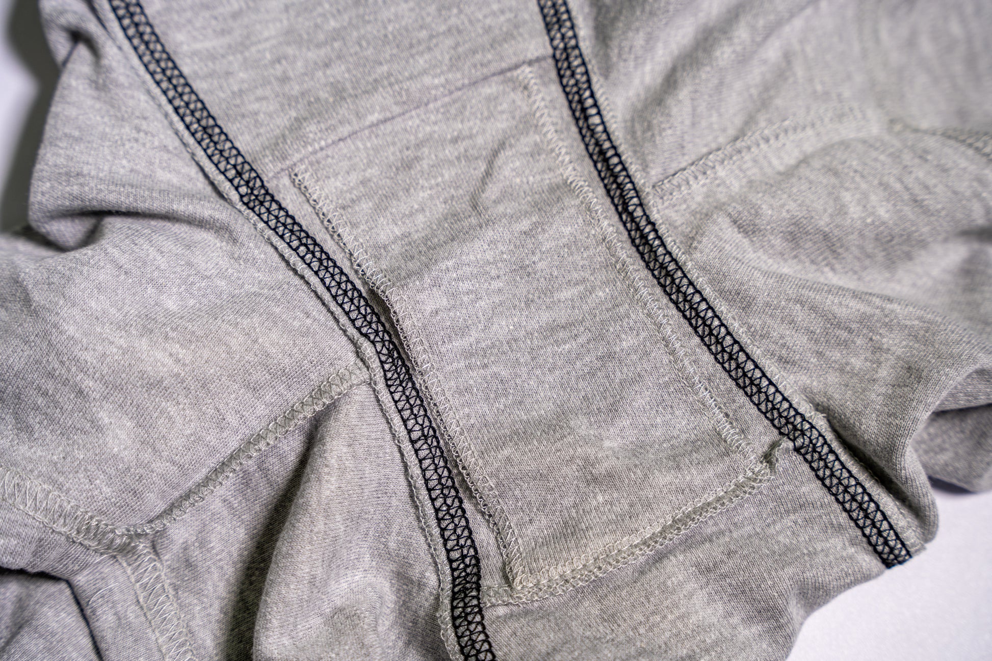 Close-up of gray boxers with black elastic waistband